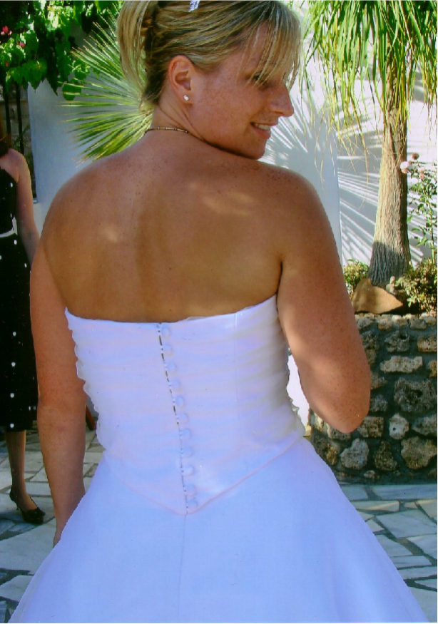 Finished with covered buttons and zip closure.